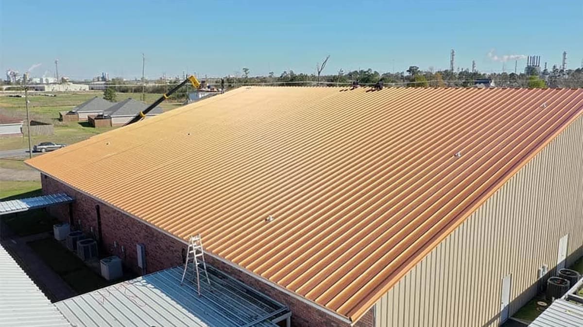 Metal roofing panel installation in progress on an Indiana home