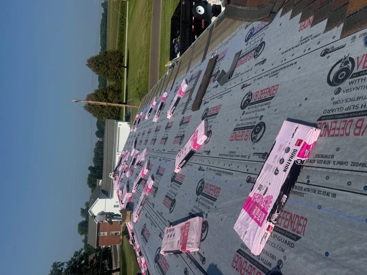 Fresh roof decking exposed during a full tear-off in Indianapolis